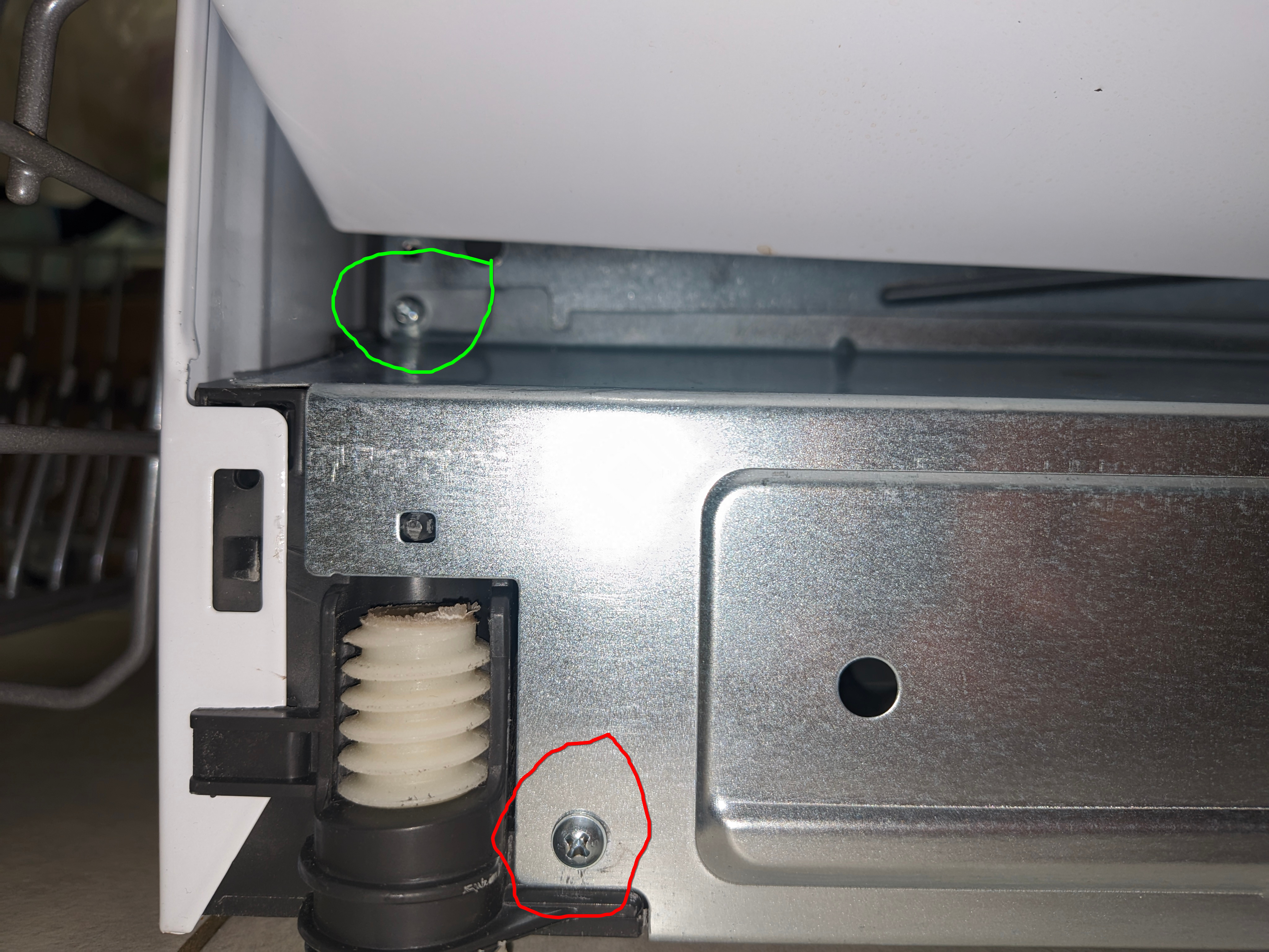 The screws you need to remove to get the bottom panel off (repeat on the other side)
