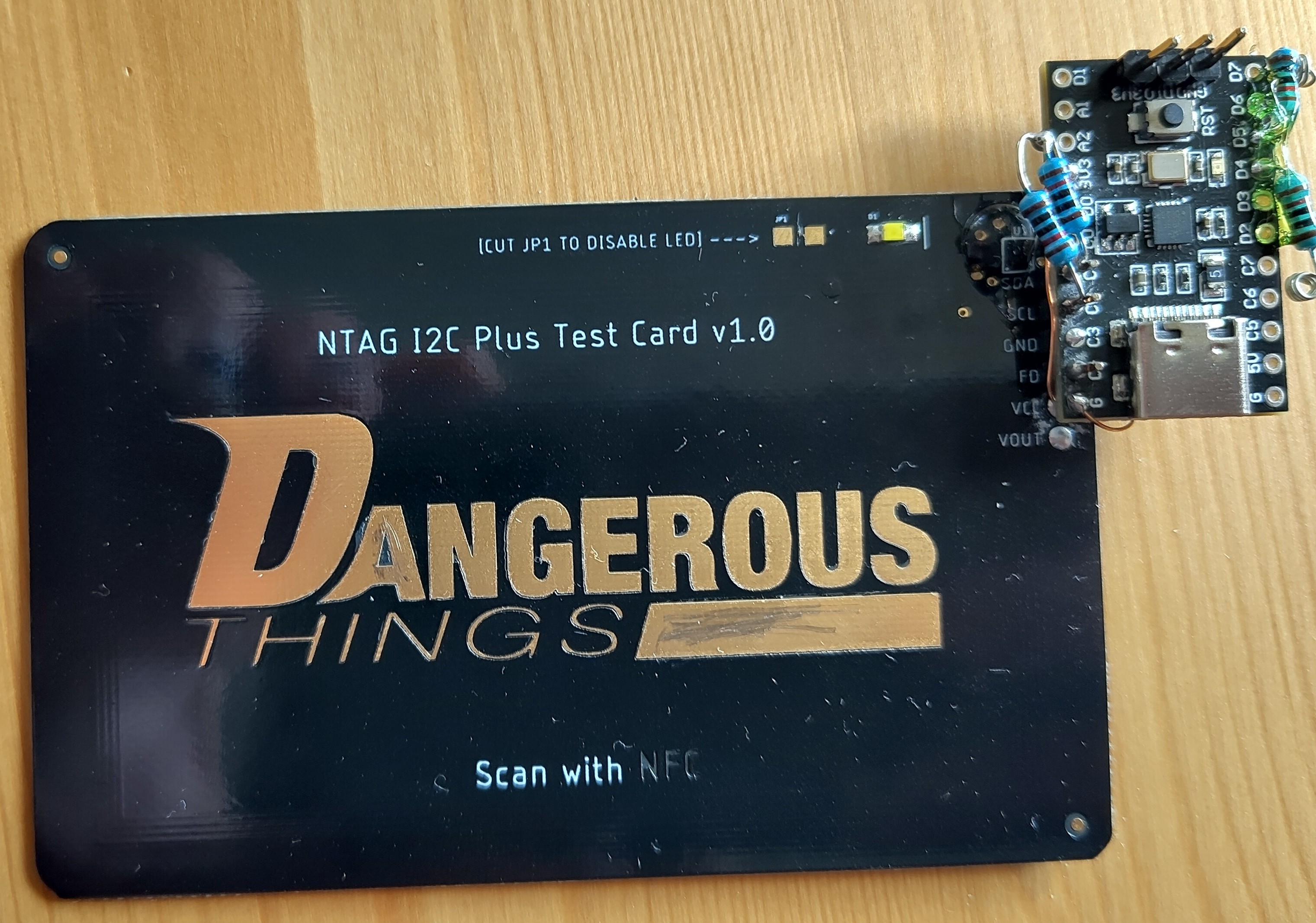 Development hardware, with a microcontroller soldered to the Dangerous Things test card