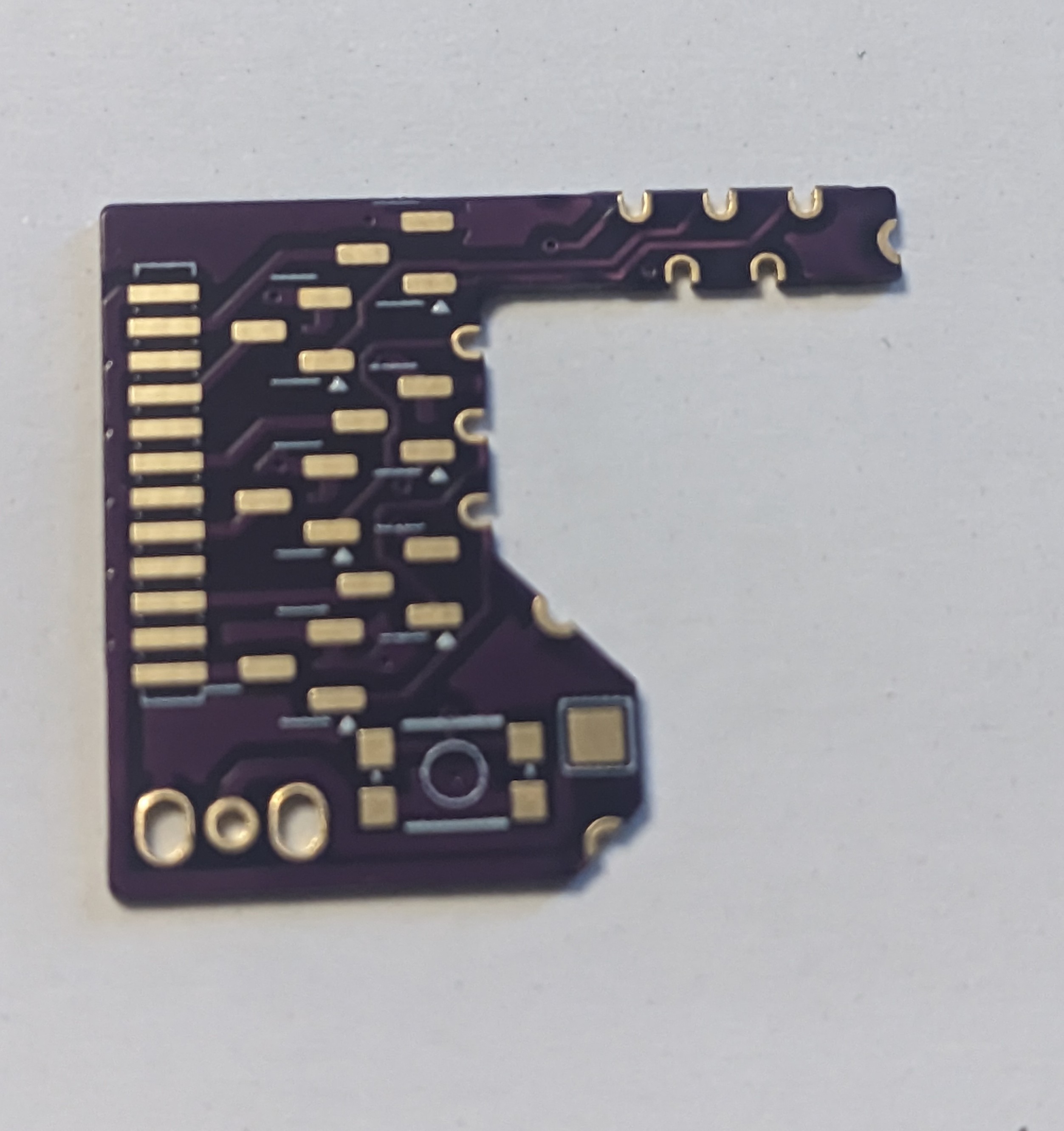 A purple circuit board with a C shape