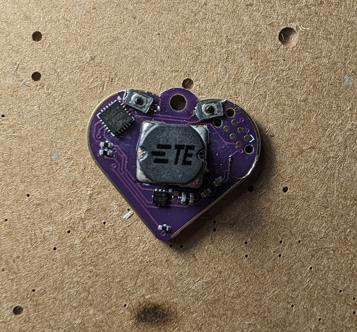 A small purple heart shaped circuit board